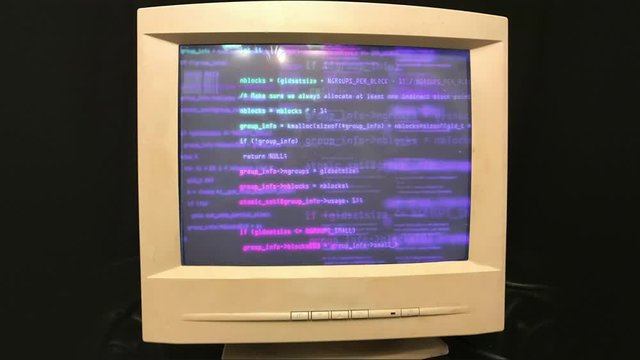 Hacking a vintage old vintage TV or computer monitor screen 80s 90s style. Glitches on screen monitor. Abstract source code data flow. Purple and blue text. screen noise. VHS style. Old kinescope