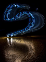 alphabet from a light painted shapes  on a wood table 