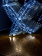 alphabet from a light painted shapes  on a wood table 