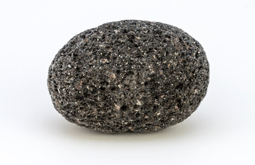 A pic of a perfectly oval shaped volcanic rock eroded by the sea