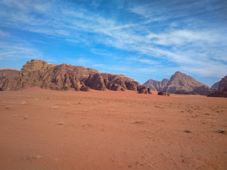 Fototapeta na wymiar rock formations and desert landscape of Wadi Rum desert in southern Jordan. Popular tourist destination and place of Lawrence of Arabia