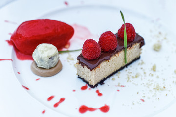 Chocolate Souffle dessert with fresh raspberry and fruit sorbet
