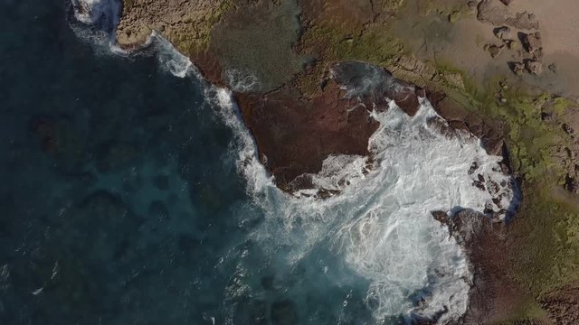 Aerial view of a rocky region of coastal Puerto Rico. Cinematic 4K establishing shot.