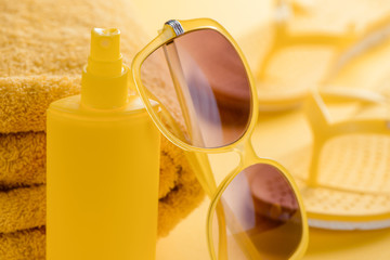 Sunscreen spray and sunglasses