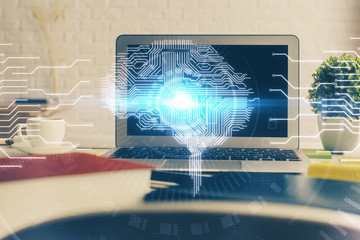 Double exposure of work space with computer and human brain drawing hologram. Brainstorm concept.