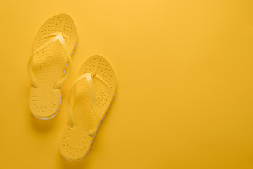 Flip-flop sandals on yellow background