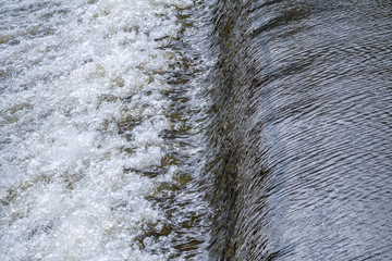 A small flat cascade in a calm river