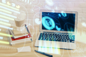 Double exposure of desktop computer and technology theme hologram. Concept of software development.