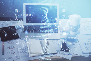 Desktop computer background and DNA drawing. Double exposure. Science concept.