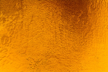 Golden wall plaster glitter texture