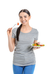 Young woman with salad on white background. Weight loss concept