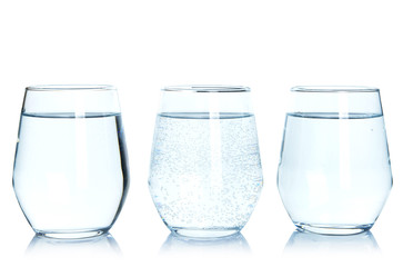 Glasses of fresh water on white background