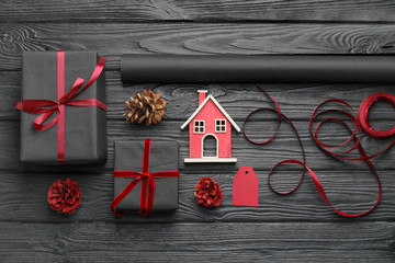 Beautiful gifts for Christmas with decor on dark wooden background