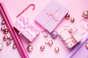 Beautiful gifts for Christmas with decor on color background