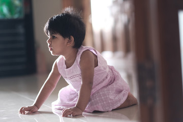 Fototapeta na wymiar happy asian baby child girl playing on floor 