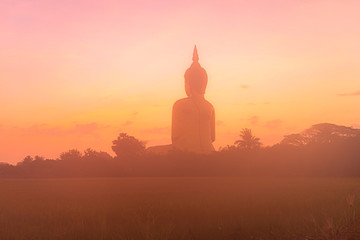sunrise above the great Buddha of Thailand at wat Muang Ang Thong Thailand. .The largest Buddha...