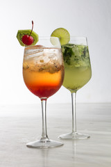 two delicious coktails with lemon and cherry