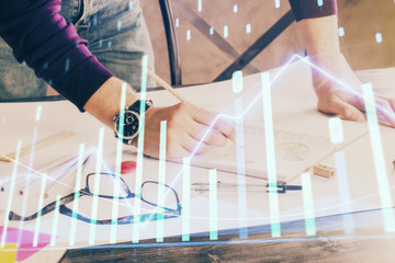 Multi exposure of man standing and planing investment with stock market forex chart.