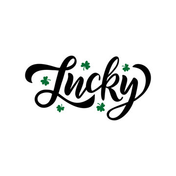 Hand drawn brush faux calligraphy Lucky. St. Patrick's Day celebration typography lettering with green shamrock