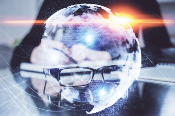 International business hologram over woman's hands taking notes background. Concept of success....