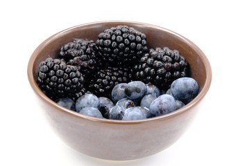Blueberry and Blackberry on blown cup with white background, fruit concept