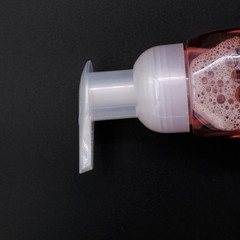 Hand wash gel on black background, anti coronavirus concept