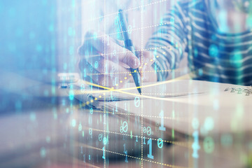 Double exposure of hands making notes with digital coding icons. Computer learning concept.
