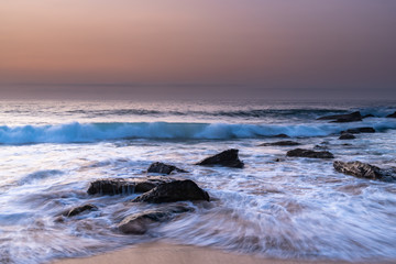 Fototapeta na wymiar Pretty Pastel Summer Sunrise by the Sea