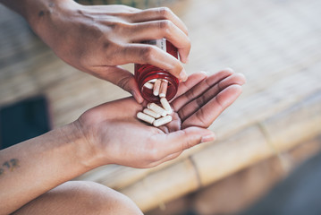 Pills and medicine in woman hands, Hazardous drugs have adverse effects on health.