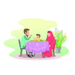 a Muslim family eating together, father gave the example of eating with the right hand and praying before starting eat