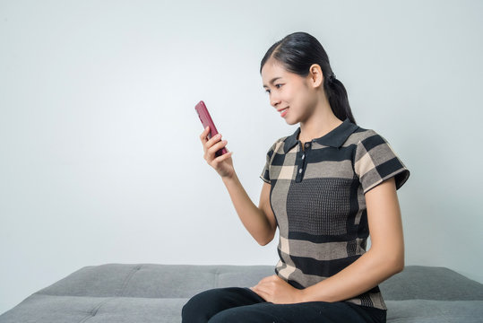 Young asian woman using phone, facial recognition system, biometrics concepts.