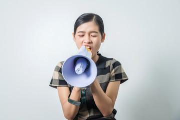 Young beautiful asian woman holding loudspeaker, black hair.