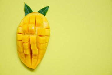 Mango slice and mango leaves from tree tropical summer fruit concept / Sweet ripe mangos cut half
