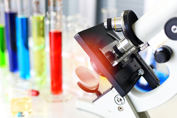 Microscope in modern lab for scientist research science or medical - microscope with metal lens at laboratory biochemistry genetics forensics microbiology test tube