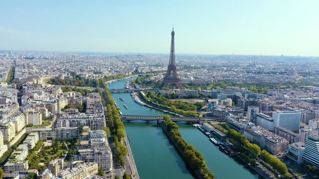 PARIS, FRANCE - MAY, 2019: Aerial drone view of Eiffel tower and Seine river in historical city centre from above.