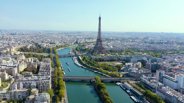 PARIS, FRANCE - MAY, 2019: Aerial drone view of Eiffel tower and Seine river in historical city centre from above.