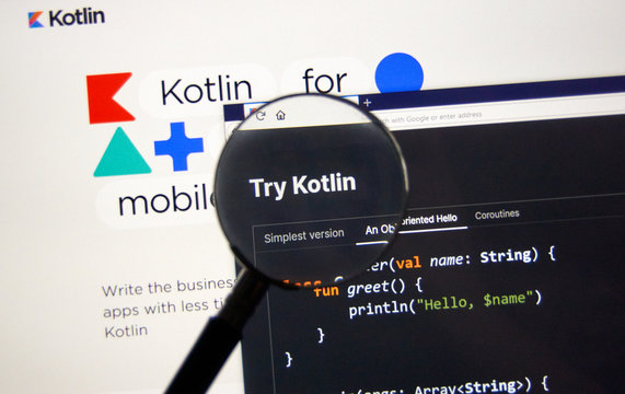 Kotlin example code, site and logo under magnifying glass