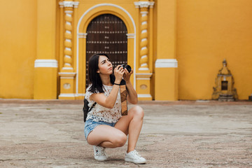 mexican girl with camara, Female photographer taking pictures on South America in vacations