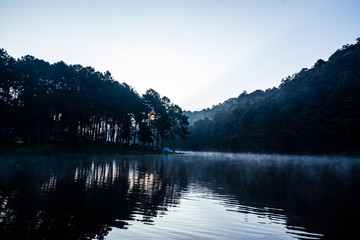 The landscape of the reservoir and the morning fog