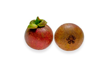 Mangosteen fruit and cross section showing the thick purple skin and white flesh of the queen of fruits.
