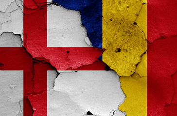 flags of England and Romania painted on cracked wall