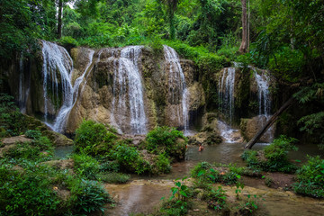 Naklejka na ściany i meble Tran Sawan Waterfall, Phayao Province Thailand. Soft water of the stream in the natural park, Beautiful waterfall in rain forest