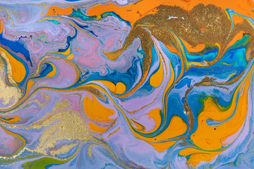 Fototapeta na wymiar Blue and orange marbling liquid background. Fluid art abstract texture. Mixed acrylic inks.