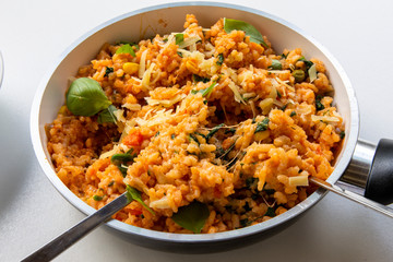 Risotto with tomatoes, fresh herbs and parmesan cheese