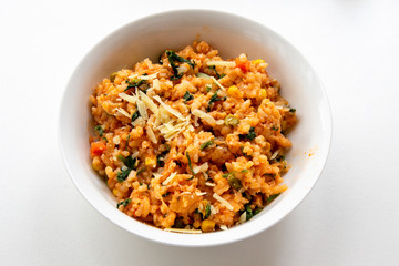Risotto with tomatoes, fresh herbs and parmesan cheese