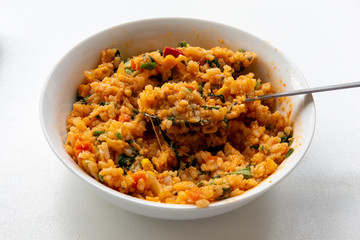 Risotto with tomatoes, fresh herbs and parmesan cheese