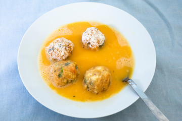Roll the arancini ball inside the egg