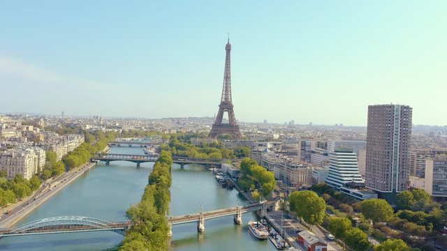 PARIS, FRANCE - MAY, 2019: Aerial drone view of Eiffel tower and Seine river in historical city centre from above.
