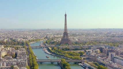 PARIS, FRANCE - MAY, 2019: Aerial drone view of Eiffel tower and Seine river in historical city centre from above.