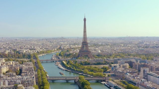 PARIS, FRANCE - MAY, 2019: Aerial drone view of Eiffel tower and Seine river in historical city centre from above.
